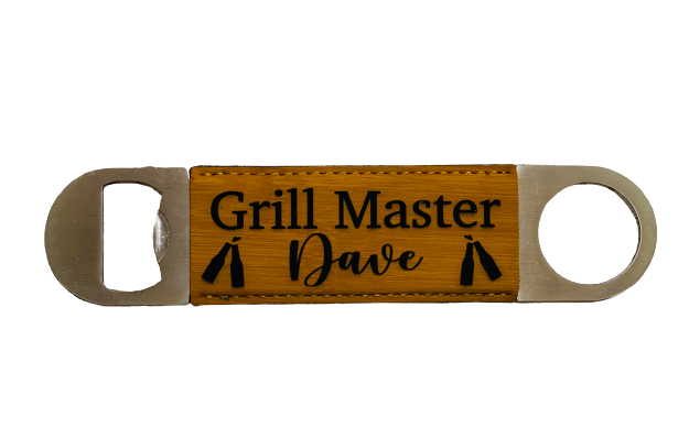 A personalized leatherette bottle opener with a bamboo bottom and silver-colored metal handle, with the name 'Grill master dave and 4 beer bottles' laser engraved on the bamboo section.