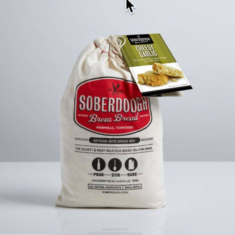 Bag of Soberdough Brew Bread with a smaller product packaging on top against a gray background