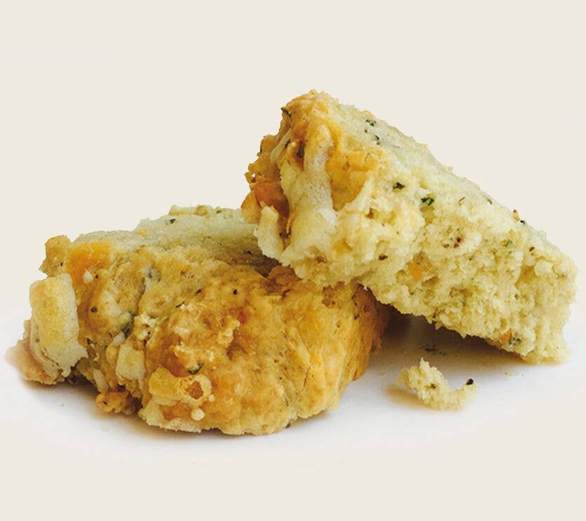 Two biscuit pieces on a light beige background