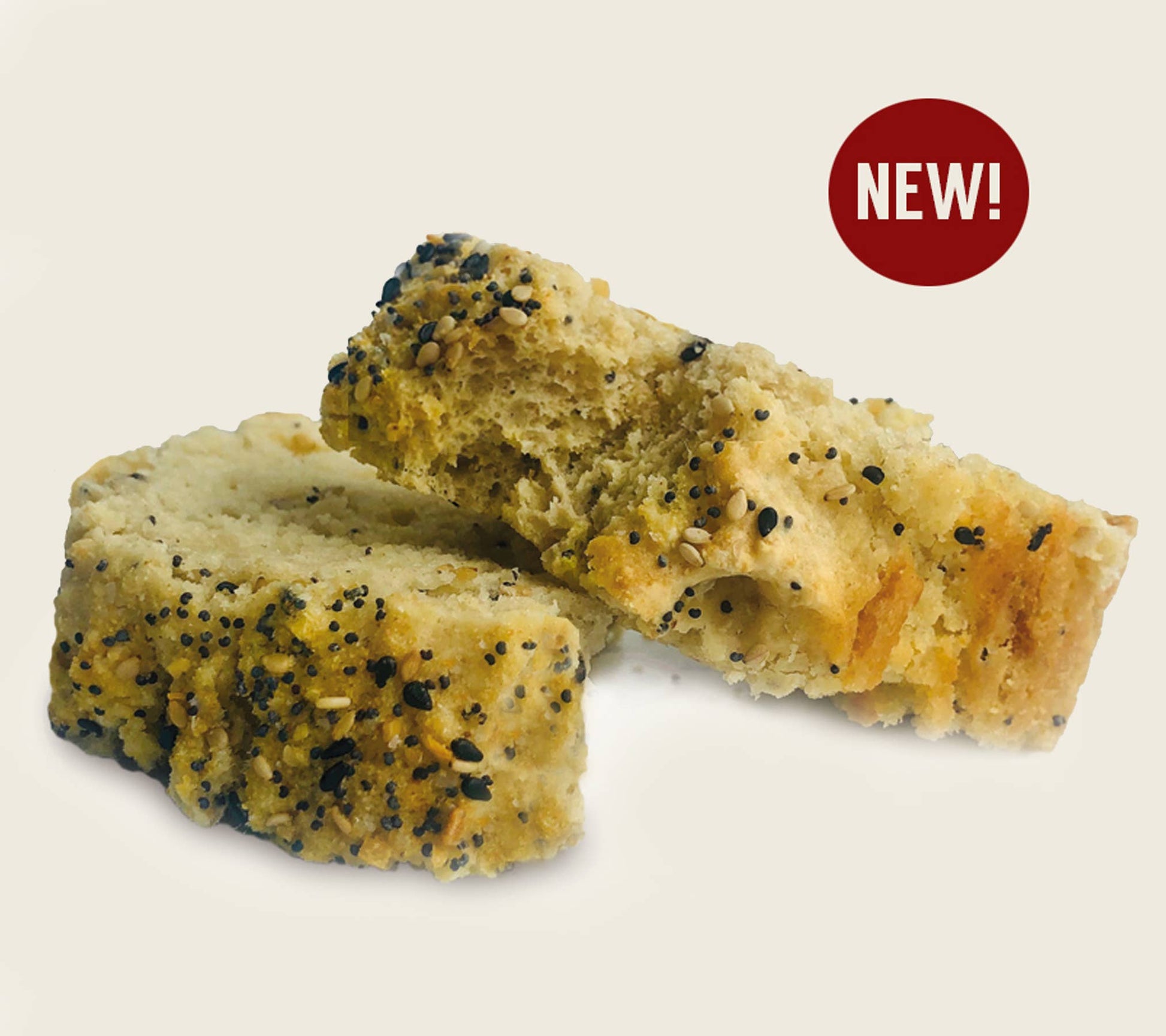 Two pieces of bread with poppy seeds on a beige background, featuring a 'NEW!' label.
