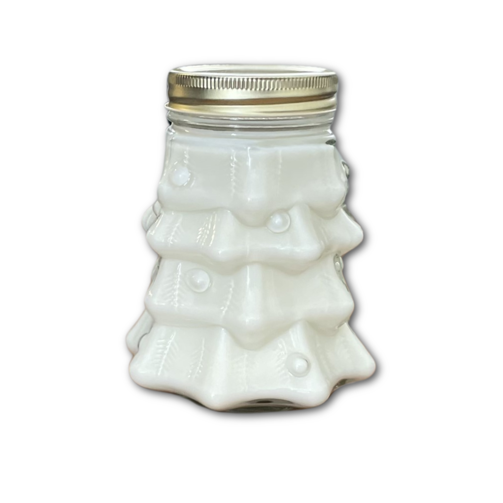 candle in a jar shaped like a Christmas tree