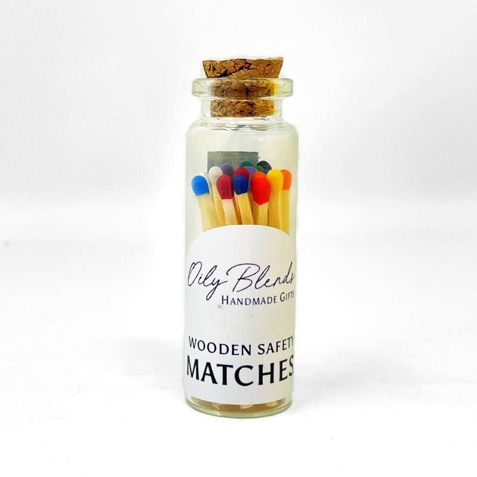 Jar of wooden safety matches with a cork lid on a white background